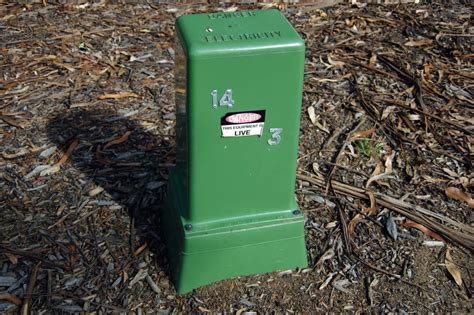 green electrical box on lawn|residential electrical transformer box.